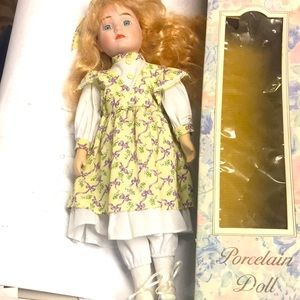 Vintage porcelain doll.  New condition with box
